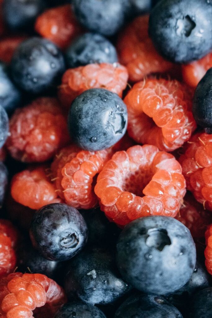 The Art of Drawing Readers In: Your attractive post title goes here Close-up view of fresh blueberries and raspberries, highlighting their vibrant colors and textures.